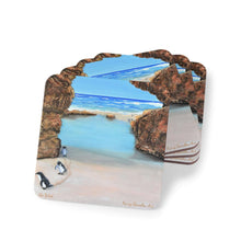 Load image into Gallery viewer, Corkwood underside, glossy finish on top. 1 or 4 pc sets. 9.5x9.5cm Penguins marching from a turquoise ocean up a rocky beach