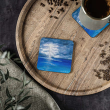 Load image into Gallery viewer, Corkwood underside, glossy finish on top. 1 or 4 pc sets. 9.5 x 9.5cm. Stormy sky with lightning crashing over a calm sea