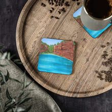 Load image into Gallery viewer, Corkwood underside, glossy finish on top. 1 or 4 pc sets. 9.5x9.5cm. Fortescue Falls in the Pilbara Region Western Australia
