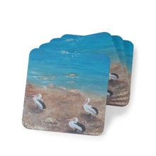 Load image into Gallery viewer, Corkwood underside, glossy finish on top. 1 or 4 pc sets. 9.5 x 9.5cm. Three Australian pelicans on a river bank