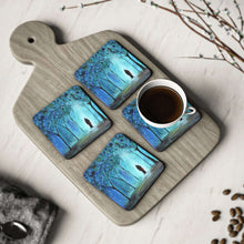 Load image into Gallery viewer, Corkwood underside, glossy finish on top. 1 or 4 pc sets. 9.5 x 9.5cm. Mystical & spiritual couple in white light in a forest