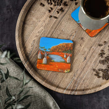 Load image into Gallery viewer, Corkwood underside, glossy finish on top. Available in 1 or 4 pc sets. 9.5 x 9.5cm. Outback Australia, Uluru, Boab trees, emu