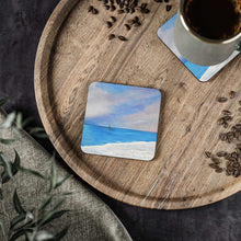 Load image into Gallery viewer, Corkwood underside, glossy finish on top. 1 or 4 pc sets. 9.5 x 9.5cm. Sunset at iconic Cottesloe Beach, Western Australia.