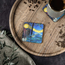 Load image into Gallery viewer, Corkwood underside, glossy finish on top. Available in 1 or 4 pc sets. 9.5 x 9.5cm. Colourful pathway of lights in the rain.