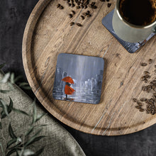 Load image into Gallery viewer, Corkwood underside, glossy finish on top. 1 or 4 pc sets. 9.5x9.5cm. Lady wearing red w/ umbrella, city & water reflections