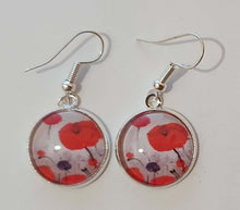 Load image into Gallery viewer, Original painting of red poppies with an abstract background on surgical steel 14mm round fishhook earrings
