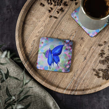 Load image into Gallery viewer, Corkwood underside, glossy finish on top. Comes in 1 or 4 pc sets 9.5 x 9.5cm. Blue butterfly on flower & abstract background