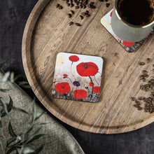 Load image into Gallery viewer, Corkwood underside, glossy finish on top. 1 or 4 pc sets. 9.5x9.5cm. ANZAC inspired red poppies for fallen service personnel