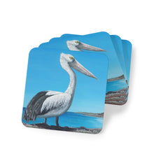 Load image into Gallery viewer, Corkwood underside, glossy finish on top. 1 or 4 pc sets. 9.5 x 9.5cm. Australian pelican overlooking a beach from a cliff