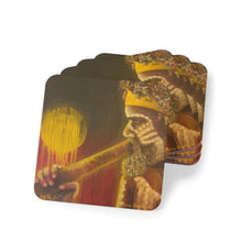 Load image into Gallery viewer, Corkwood underside, glossy finish on top. 1 or 4 pc sets. 9.5 x 9.5cm. First Nations Aboriginal male playing a didgeridoo
