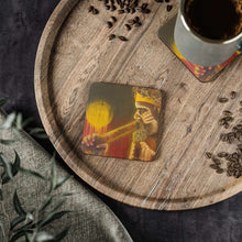 Load image into Gallery viewer, Corkwood underside, glossy finish on top. 1 or 4 pc sets. 9.5 x 9.5cm. First Nations Aboriginal male playing a didgeridoo