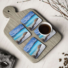 Load image into Gallery viewer, Corkwood underside, glossy finish on top. 1 or 4 pc sets. 9.5x9.5cm. Turquoise ocean, beach rocks, Denmark Western Australia.