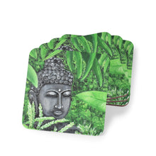 Load image into Gallery viewer, Corkwood underside, glossy finish on top. 1 or 4 pc sets. 9.5 x 9.5cm. Serene Buddha statue head amongst garden greenery