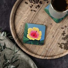 Load image into Gallery viewer, Corkwood underside, glossy finish on top. 1 or 4 pc sets. 9.5 x 9.5cm. Yellow & pink hibiscus on greenery