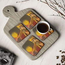 Load image into Gallery viewer, Corkwood underside, glossy finish on top. 1 or 4 pc sets. 9.5 x 9.5cm. First Nations Aboriginal male playing a didgeridoo