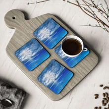 Load image into Gallery viewer, Corkwood underside, glossy finish on top. 1 or 4 pc sets. 9.5 x 9.5cm. Stormy sky with lightning crashing over a calm sea