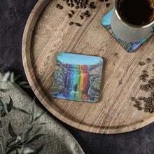 Load image into Gallery viewer, Corkwood underside, glossy finish on top. 1 or 4 pc sets. 9.5x9.5cm. Silhouette of a woman under a chakra-coloured waterfall