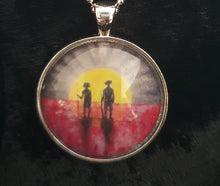 Load image into Gallery viewer, 30mm Pendant/Chain -Abstract Aboriginal flag/Rising Sun silhouette of Aboriginal holding spear, soldier holding gun & poppies
