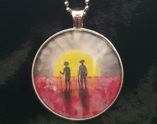 Load image into Gallery viewer, 38mm Pendant/Chain -Abstract Aboriginal flag/Rising Sun silhouette of Aboriginal holding spear, soldier holding gun &amp; poppies
