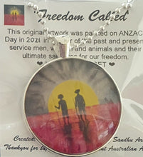 Load image into Gallery viewer, 38mm Pendant/Chain -Abstract Aboriginal flag/Rising Sun silhouette of Aboriginal holding spear, soldier holding gun &amp; poppies

