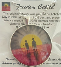 Load image into Gallery viewer, 38mm Pendant/Chain -Abstract Aboriginal flag/Rising Sun silhouette of Aboriginal holding spear, soldier holding gun & poppies