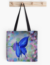 Load image into Gallery viewer,  Original painting of a blue butterfly on a purple flower with coloured bokeh lights behind on a 33 x 33cm tote bag
