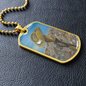 Digger's slouch hat resting on a gun with an ANZAC inspired Crest on a military style dog tag pendant with ball chain