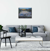 Load image into Gallery viewer, Original painting of a black and white cow eating with the sun rising by Kerry Sandhu Art