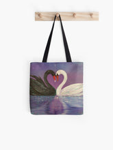 Load image into Gallery viewer, Black and a white swan touch heads to form a love heart with the heart reflecting in the water on a 33 x 33cm tote bag