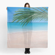Load image into Gallery viewer, Original painting of a tranquil tropical beach with palm leaves on a large square 140x140cm scarf / wrap / shawl
