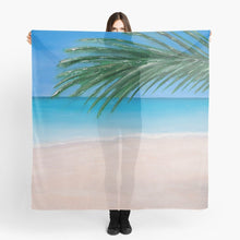 Load image into Gallery viewer, Original painting of a tranquil tropical beach with palm leaves on a large square 140x140cm scarf / wrap / shawl