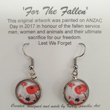 Load image into Gallery viewer, Original painting of red poppies with an abstract background on surgical steel 14mm round fishhook earrings