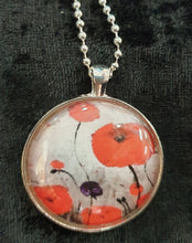 Load image into Gallery viewer, Original painting of red poppies with an abstract background on a silver coloured 38mm pendant with a 60cm ball chain