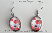Load image into Gallery viewer, Original painting of red poppies with an abstract background on surgical steel 13 x 18mm oval earrings
