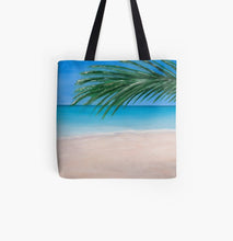 Load image into Gallery viewer, Original painting of a tranquil tropical beach with palm leaves on a 41 x 41cm tote bag