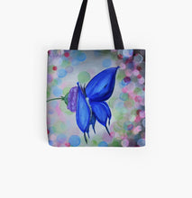 Load image into Gallery viewer, Original painting of a blue butterfly on a purple flower with coloured bokeh lights behind on a 33 x 33cm tote bag
