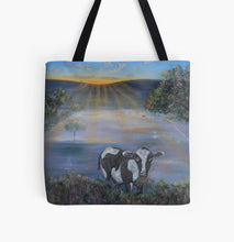 Load image into Gallery viewer, Original painting of a black and white cow eating with the sun rising on a 41 x 41cm tote bag

