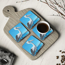 Load image into Gallery viewer, Corkwood underside, glossy finish on top. 1 or 4 pc sets. 9.5 x 9.5cm. Australian pelican overlooking a beach from a cliff

