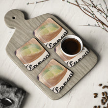 Load image into Gallery viewer, Corkwood underside, glossy finish on top. 1 or 4 pc sets. 9.5 x 9.5cm. Lime slice in a frothy beer bottle with bubble rising
