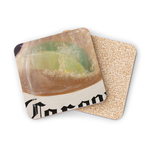 Corkwood underside, glossy finish on top. 1 or 4 pc sets. 9.5 x 9.5cm. Lime slice in a frothy beer bottle with bubble rising