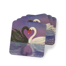 Load image into Gallery viewer, Corkwood underside, glossy finish on top. 1 or 4 pc sets. 9.5x9.5cm. Black &amp; white swans touching heads creating a love heart
