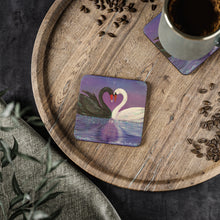 Load image into Gallery viewer, Corkwood underside, glossy finish on top. 1 or 4 pc sets. 9.5x9.5cm. Black &amp; white swans touching heads creating a love heart
