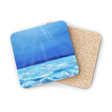 Load image into Gallery viewer, Corkwood underside, glossy finish on top. 1 or 4 pc sets. 9.5 x 9.5cm. Blue underwater scene with sunrays filtering through
