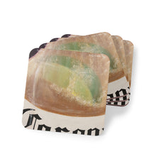 Load image into Gallery viewer, Corkwood underside, glossy finish on top. 1 or 4 pc sets. 9.5 x 9.5cm. Lime slice in a frothy beer bottle with bubble rising
