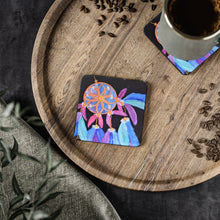 Load image into Gallery viewer, Corkwood underside, glossy finish on top. 1 or 4 pc sets. 9.5 x 9.5cm. Colourful feathered dreamcatcher w/ a black background

