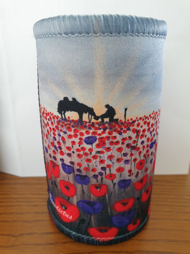 original artwork of a sunrise (in the form of the ANZAC Crest) with a silhouette of a soldier kneeling next to his horse drinking from his hat in a field of red and purple poppies on a double stitched excellent quality stubby holder / cooler