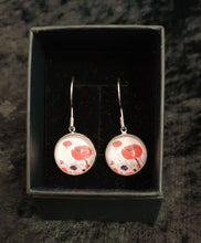 Load image into Gallery viewer, Original painting of red poppies with an abstract background on surgical steel 14mm round fishhook earrings
