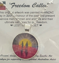 Load image into Gallery viewer, 25mm Pendant/Chain -Abstract Aboriginal flag/Rising Sun silhouette of Aboriginal holding spear, soldier holding gun &amp; poppies
