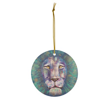 Load image into Gallery viewer, Original painting of a bold coloured lion head close up on a round ceramic ornament with hanging string
