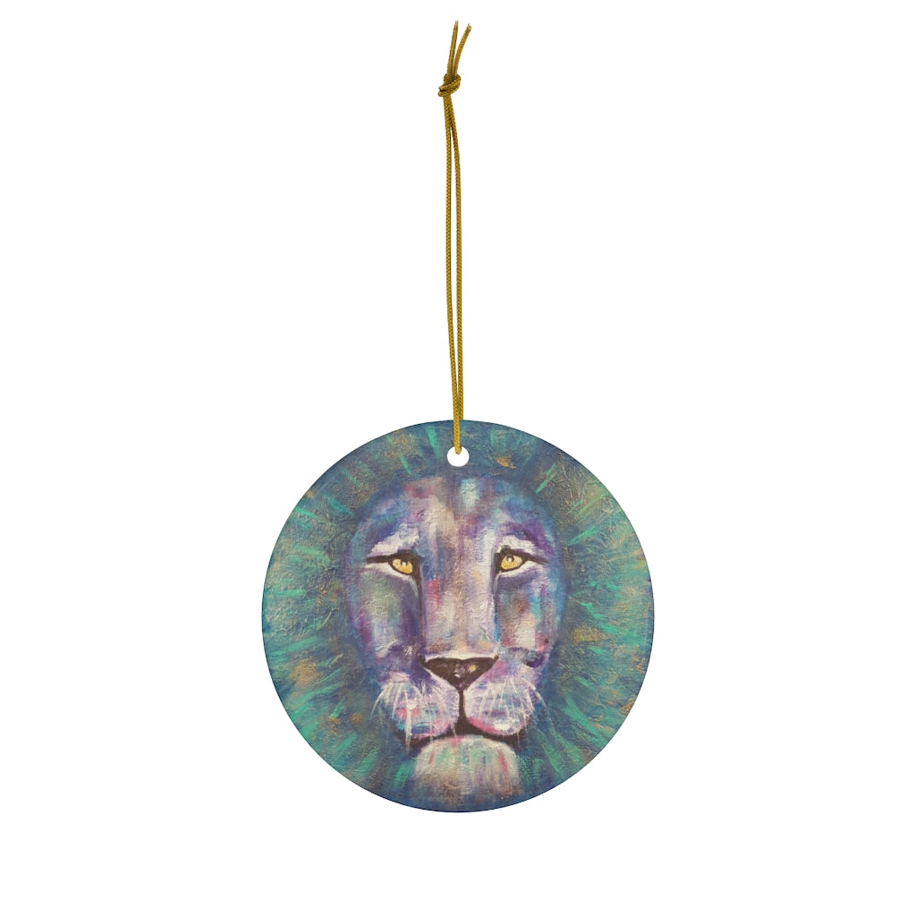 Original painting of a bold coloured lion head close up on a round ceramic ornament with hanging string